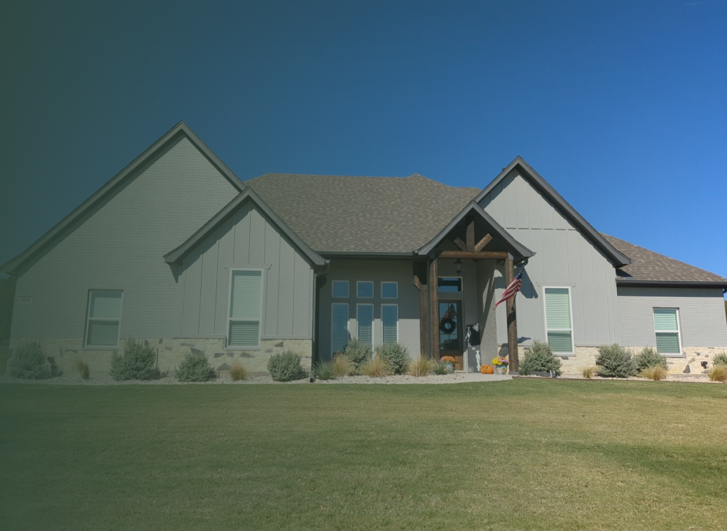 A large house with a flag on the front of it